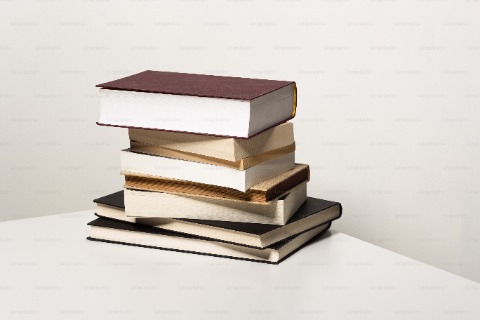 Books stacked on a desk
